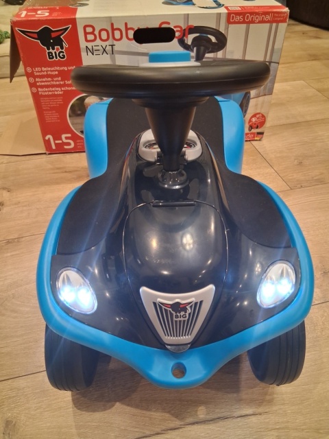 BIG Jeździk Next Blue z Klaksonem i Światłami Po zwrocie